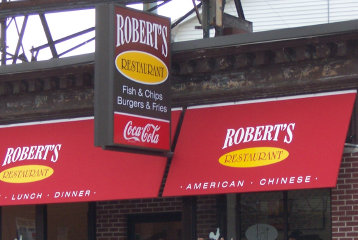 Awning logo and lighted sign panels